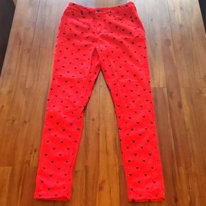 Red stretch pants with Mickey Mouse polka dots